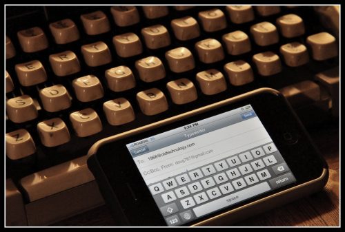 Typewriter and phone photo